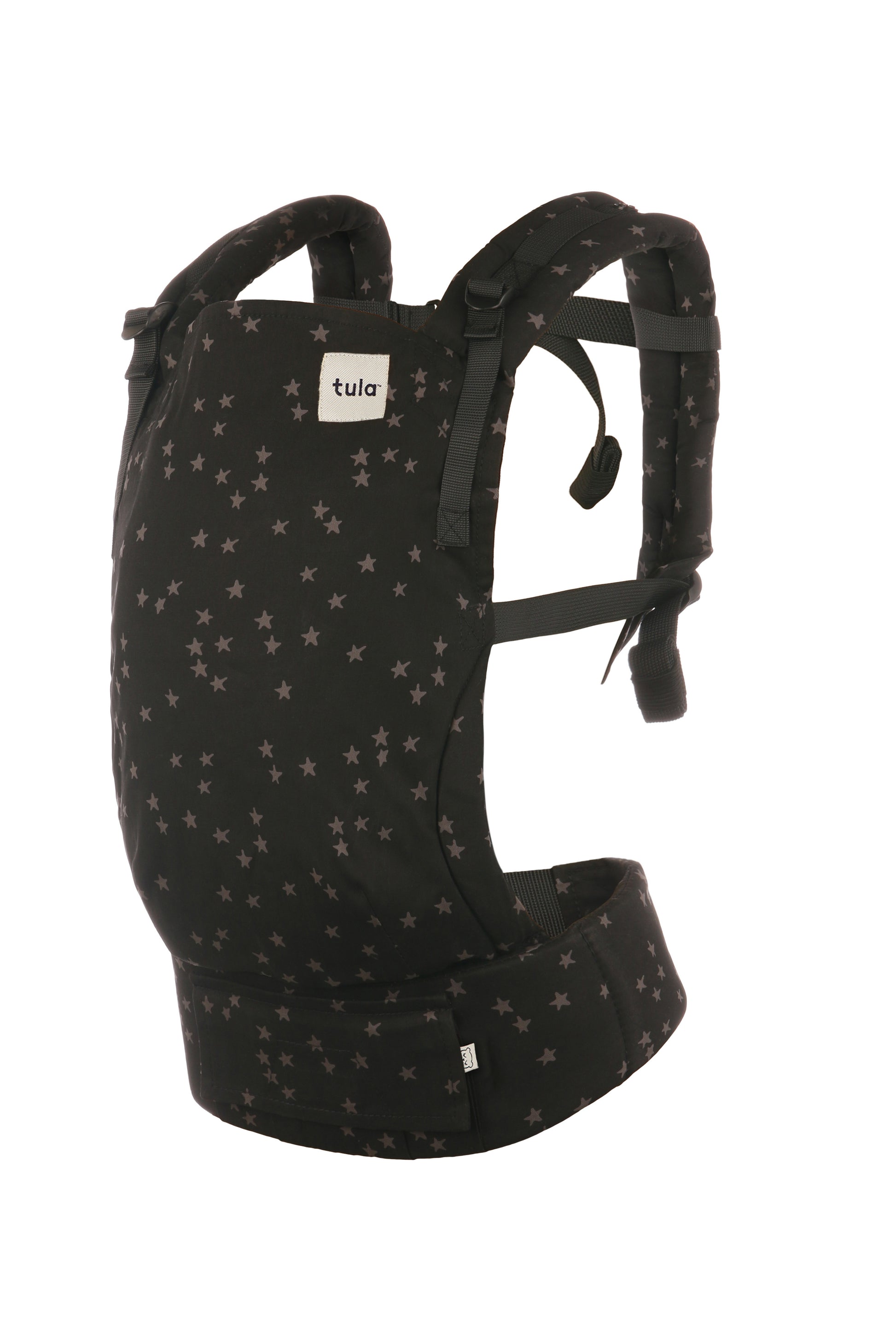 Nosidełko Tula Free-to-Grow Discover z szarymi gwiazdkami na czarnym tle pokrywającymi całe nosidełko oraz kapturek.