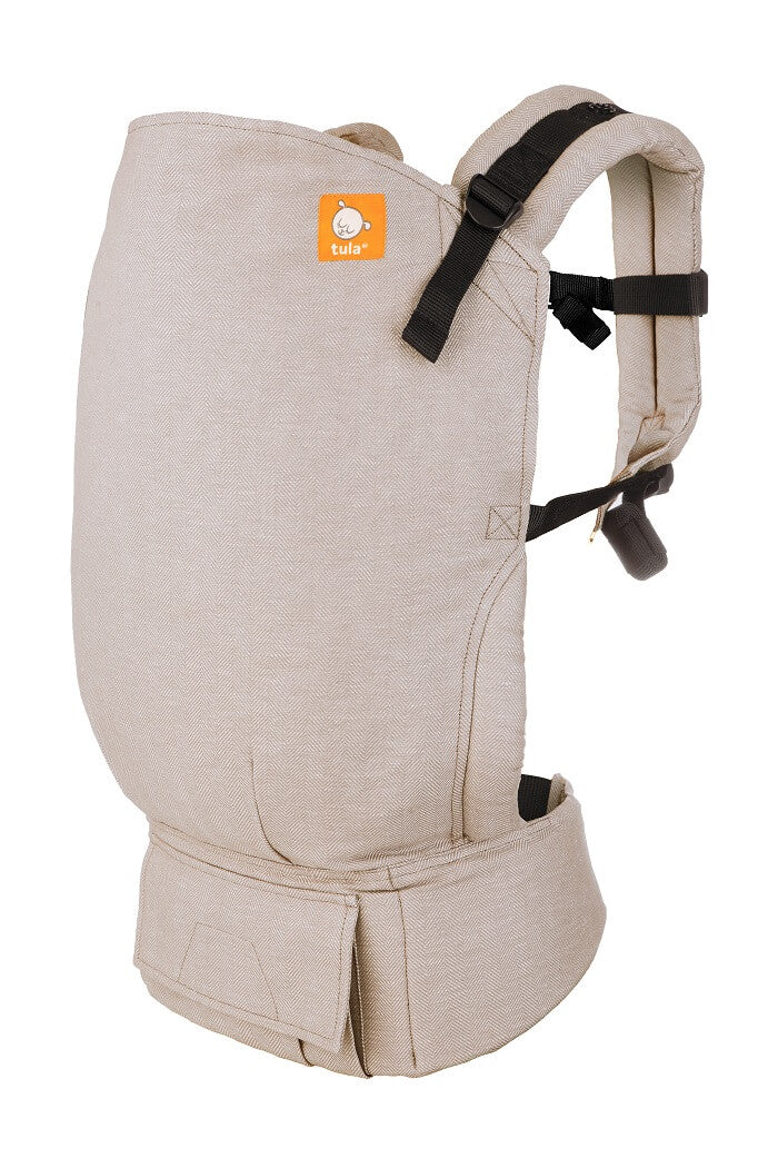 Ergonomiczne Nosidełko Toddler Linen Sand od Tula w delikatnych odcieniach beżu.